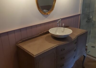 Bathroom vanity unit created by up-cycling sideboard