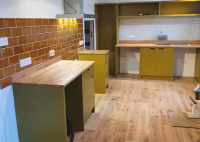 Bespoke hand made and finished birch ply kitchen with solid oak worktops