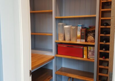 Bespoke hand made and finished larder with solid oak worktops, adjustable shelving and wine rack