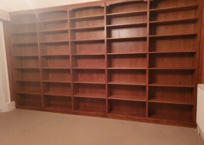 Bespoke solid oak bookcase stained to match existing furniture
